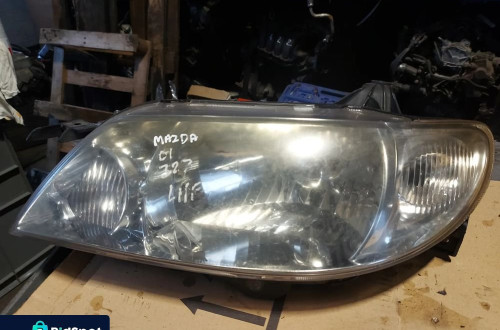 Reflektor lampa lewa przednia lewy przód Mazda 323 '01r Anglik