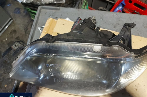 Reflektor lampa lewa przednia lewy przód Mazda 323 '01r Anglik