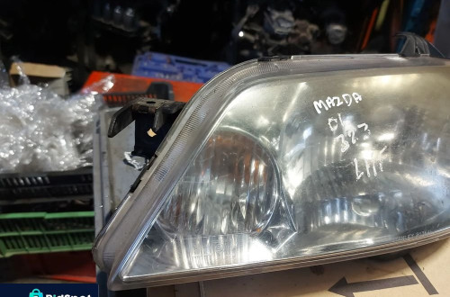 Reflektor lampa lewa przednia lewy przód Mazda 323 '01r Anglik